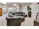 Finished basement featuring a large sectional couch, tv, and large windows at 764 Sharpshooters Nw Rdg, Marietta, GA 30064