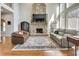 Inviting living room with stone fireplace, TV, and large windows for plenty of light at 764 Sharpshooters Nw Rdg, Marietta, GA 30064