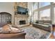 Beautiful living room with stone fireplace, large windows and comfortable seating at 764 Sharpshooters Nw Rdg, Marietta, GA 30064