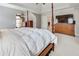 A four-poster bed with a dresser and a large television set in the spacious main bedroom at 764 Sharpshooters Nw Rdg, Marietta, GA 30064