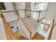 A bright, carpeted staircase ascends through the home, framed by white railings and wood accents at 764 Sharpshooters Nw Rdg, Marietta, GA 30064