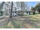 Exterior of home featuring back deck and large backyard at 2773 Marcia Dr, Lawrenceville, GA 30044