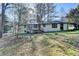 Exterior of home featuring back deck and large backyard at 2773 Marcia Dr, Lawrenceville, GA 30044