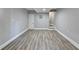 Unfinished basement space with grey wood-look flooring at 2773 Marcia Dr, Lawrenceville, GA 30044