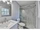 Modern bathroom featuring a glass-enclosed shower with marble-look tile and stylish fixtures at 2773 Marcia Dr, Lawrenceville, GA 30044