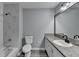 Modern bathroom featuring granite countertop, framed mirror, and luxurious tiled walk-in shower at 2773 Marcia Dr, Lawrenceville, GA 30044