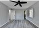 Bedroom featuring updated gray wood-look floors and two door ways at 2773 Marcia Dr, Lawrenceville, GA 30044