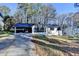 Exterior of home with driveway and attached garage. Well-maintained yard at 2773 Marcia Dr, Lawrenceville, GA 30044