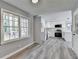 Kitchen with white cabinets and stainless steel appliances, open to a dining area at 2773 Marcia Dr, Lawrenceville, GA 30044