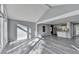 Open concept living room with vaulted ceiling, light walls and wood-look floors at 2773 Marcia Dr, Lawrenceville, GA 30044