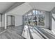 Living room with large windows overlooking yard and wood-look floors at 2773 Marcia Dr, Lawrenceville, GA 30044