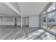 Spacious living room featuring large windows, grey walls and wood-look floors at 2773 Marcia Dr, Lawrenceville, GA 30044