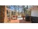 Back porch features deck with view, outdoor furniture and mature trees at 4363 Bonaparte Dr, Tucker, GA 30084