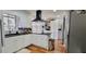 Well-lit kitchen with white cabinets, black countertops, and stainless steel appliances at 4363 Bonaparte Dr, Tucker, GA 30084