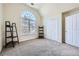 Bright bedroom with carpet flooring, a large window and closet space at 5106 Vinings Estates Se Way, Mableton, GA 30126