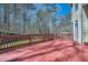 Large wooden deck overlooking a private backyard, perfect for outdoor entertaining and relaxation at 5106 Vinings Estates Se Way, Mableton, GA 30126