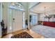 Bright foyer showcasing a hardwood floor entry, a large window and a decorative chandelier at 5106 Vinings Estates Se Way, Mableton, GA 30126