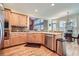 Well-lit kitchen with light wood cabinets, modern appliances, hardwood floors, and an eat-in area at 5106 Vinings Estates Se Way, Mableton, GA 30126