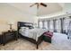 This main bedroom features an elegant tray ceiling and a stunning curved window array for abundant natural light at 5106 Vinings Estates Se Way, Mableton, GA 30126