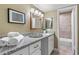 Bright bathroom featuring granite countertop, modern lighting, and a tiled shower/tub combo at 80 Montre Nw Sq, Atlanta, GA 30327