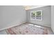 Bright bedroom features a large window, soft gray walls, and ample space for relaxation and personalization at 80 Montre Nw Sq, Atlanta, GA 30327
