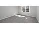 Neutral-toned bedroom with plush carpeting and a bright window, offering a calm and inviting space at 80 Montre Nw Sq, Atlanta, GA 30327