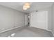 Spacious carpeted bedroom with a closet and neutral paint at 80 Montre Nw Sq, Atlanta, GA 30327