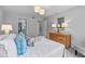 Bright bedroom featuring hardwood dresser, ambient lighting, and comfortable décor at 80 Montre Nw Sq, Atlanta, GA 30327