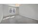 Neutral bedroom with a gray carpet and a bright window at 80 Montre Nw Sq, Atlanta, GA 30327