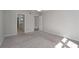 Neutral bedroom with carpet, featuring doorways to the bathroom and hallway, enhancing flow and connectivity at 80 Montre Nw Sq, Atlanta, GA 30327
