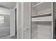Spacious closet with built-in shelving and drawers for organized storage solutions at 80 Montre Nw Sq, Atlanta, GA 30327
