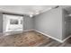 Living room featuring neutral walls, a modern ceiling fan, and hardwood floors with an area rug at 80 Montre Nw Sq, Atlanta, GA 30327