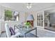 Bright office space featuring a modern glass desk, large windows, and a ceiling fan, offering an ideal work-from-home environment at 80 Montre Nw Sq, Atlanta, GA 30327