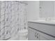 Bathroom with modern vanity, and a shower with a stylish marble curtain at 139 Jameson E Dr, Acworth, GA 30102