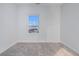 Cozy bedroom with plush carpet and a bright window showcasing the neighborhood at 139 Jameson E Dr, Acworth, GA 30102