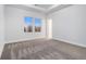 Light-filled bedroom with neutral walls, plush carpet flooring and a trey ceiling at 139 Jameson E Dr, Acworth, GA 30102