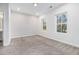 Bright bedroom with neutral carpet, recessed lights, and large windows at 139 Jameson E Dr, Acworth, GA 30102