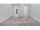View of a bedroom showing neutral walls, carpet flooring, and open doorways at 139 Jameson E Dr, Acworth, GA 30102