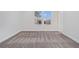 Bright bedroom showcasing neutral walls, carpet flooring, and a double-hung window at 139 Jameson E Dr, Acworth, GA 30102