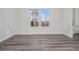 Bright dining area with hardwood floors, white trim, and a modern chandelier at 139 Jameson E Dr, Acworth, GA 30102