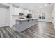Modern kitchen featuring an island, stainless steel appliances, white cabinets, and pendant lighting at 139 Jameson E Dr, Acworth, GA 30102