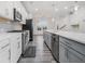 Contemporary kitchen featuring a large island, stainless steel appliances, and sleek white cabinetry at 139 Jameson E Dr, Acworth, GA 30102