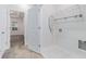 Bright laundry room features white tile, wire shelving, and space for an ironing board at 139 Jameson E Dr, Acworth, GA 30102