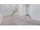 Inviting living room with neutral carpet, staircase, and ample natural light at 139 Jameson E Dr, Acworth, GA 30102