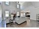 Inviting living room with a stone fireplace, large windows, and hardwood floors at 2515 Castlerock, Cumming, GA 30041