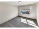 Bedroom with large window and neutral carpet at 3671 Salvia Dr, Buford, GA 30519