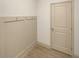 Functional entryway featuring a coat rack, neutral decor, and durable flooring at 3671 Salvia Dr, Buford, GA 30519