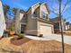 Charming two-story home with a two-car garage and landscaped front yard at 3671 Salvia Dr, Buford, GA 30519