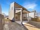 Exterior view showcasing covered patio, neutral siding, and well-maintained landscaping at 3671 Salvia Dr, Buford, GA 30519