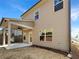Rear exterior view showcasing covered patio, neutral siding, and several windows at 3671 Salvia Dr, Buford, GA 30519
